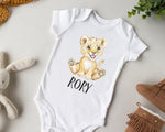 a white bodysuit with a picture of a lion cub on it